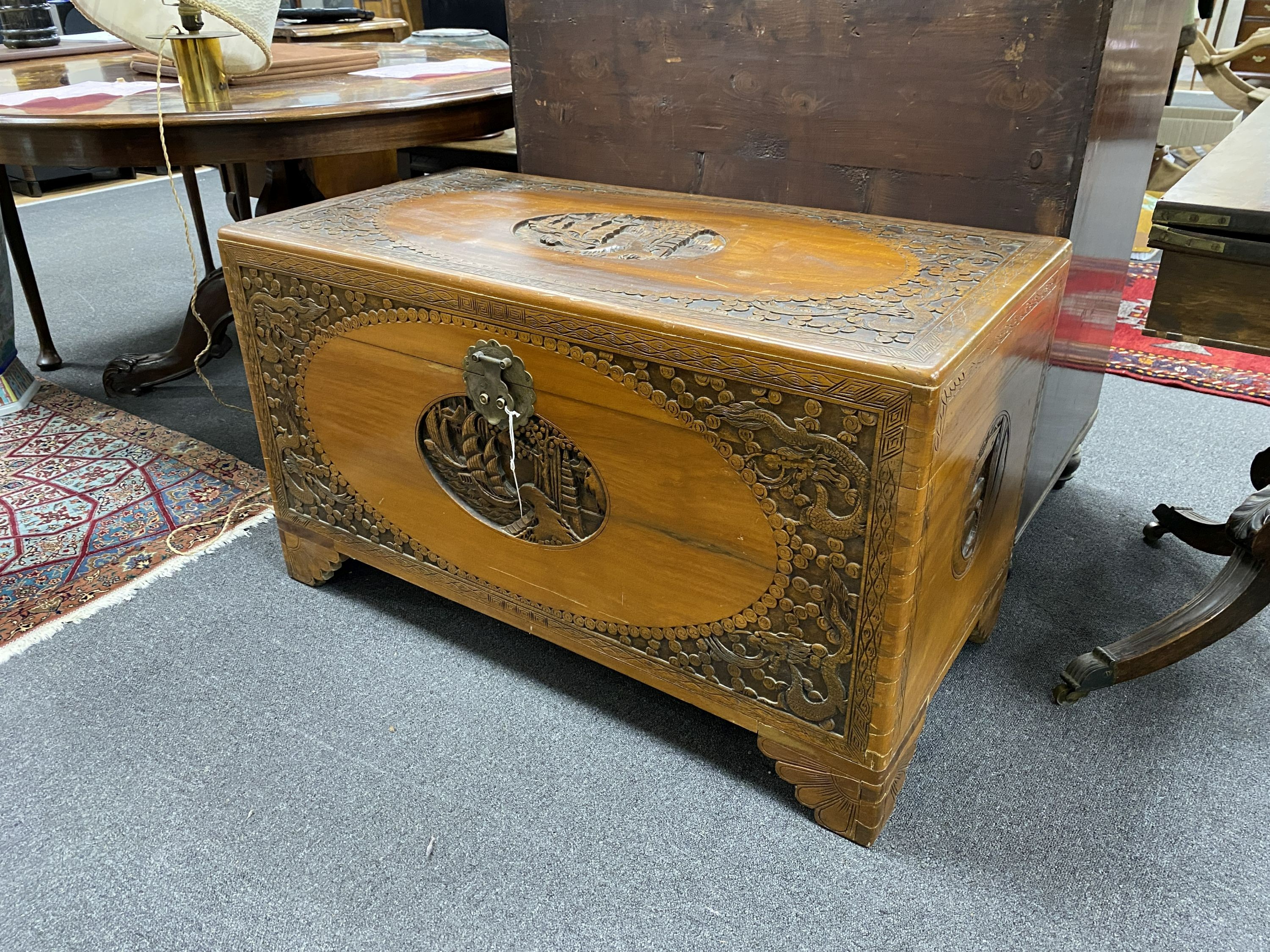 A Chinese carved camphorwood chest, length 104cm, depth 51cm, height 60cm